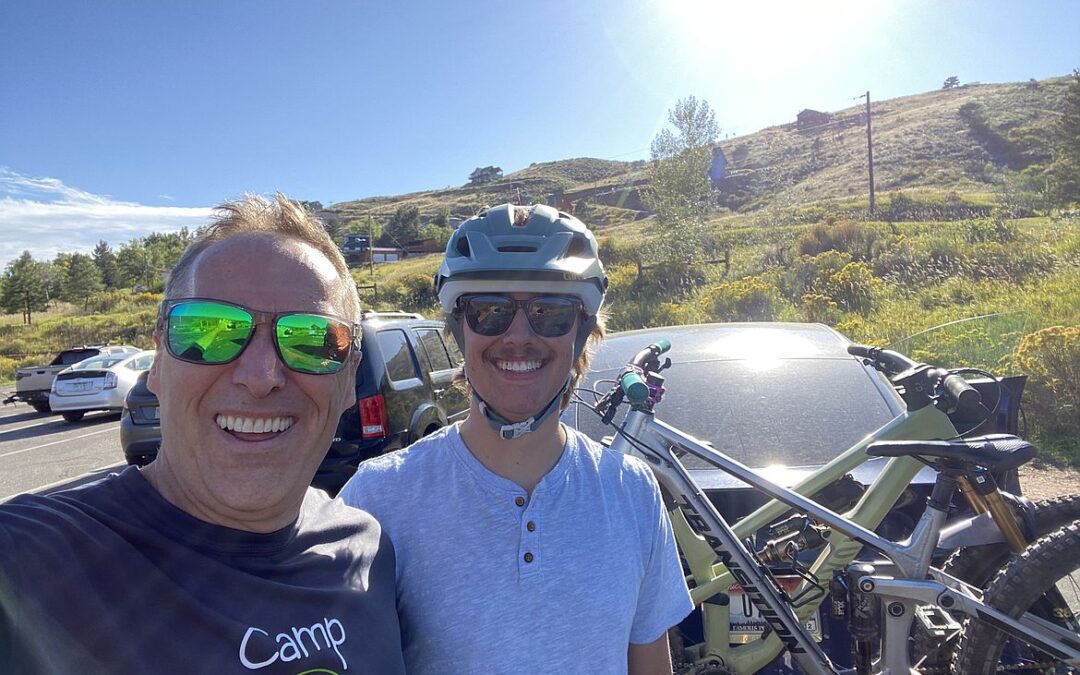 Dr. Geoff Emry and Jackson with bikes at trail