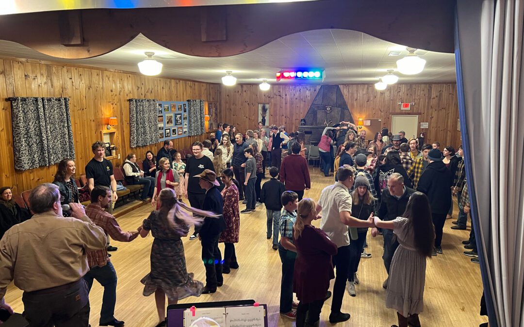 wide view of square dancers at Mice Grange