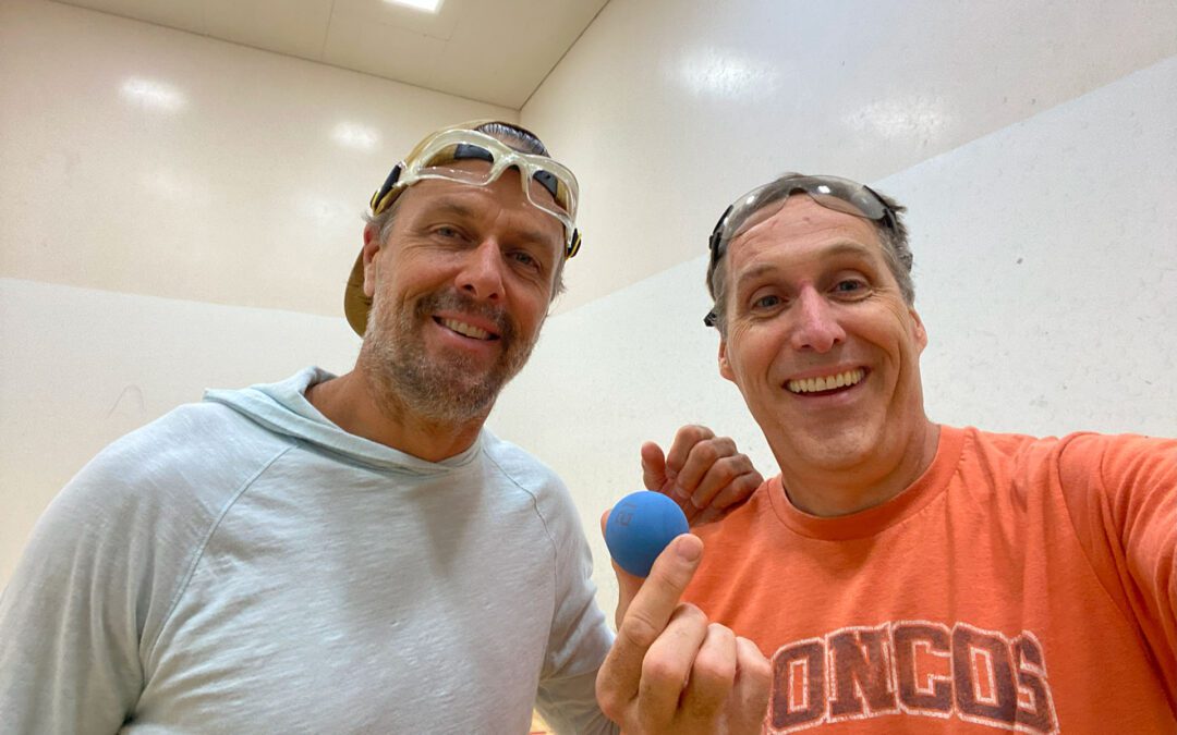 Jake Plummer and Dr. Emry smiling in handball court