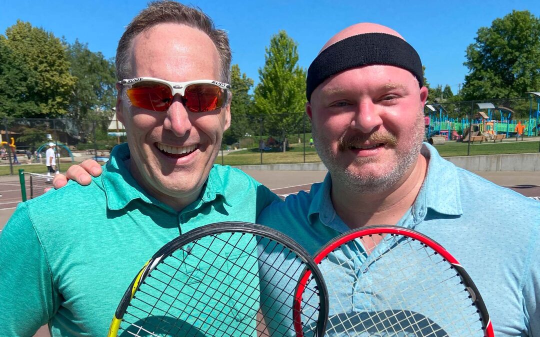 Dr. Emry and Trey Weatherly with tennis rackets